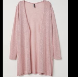 A soft pink fine knit cardigan